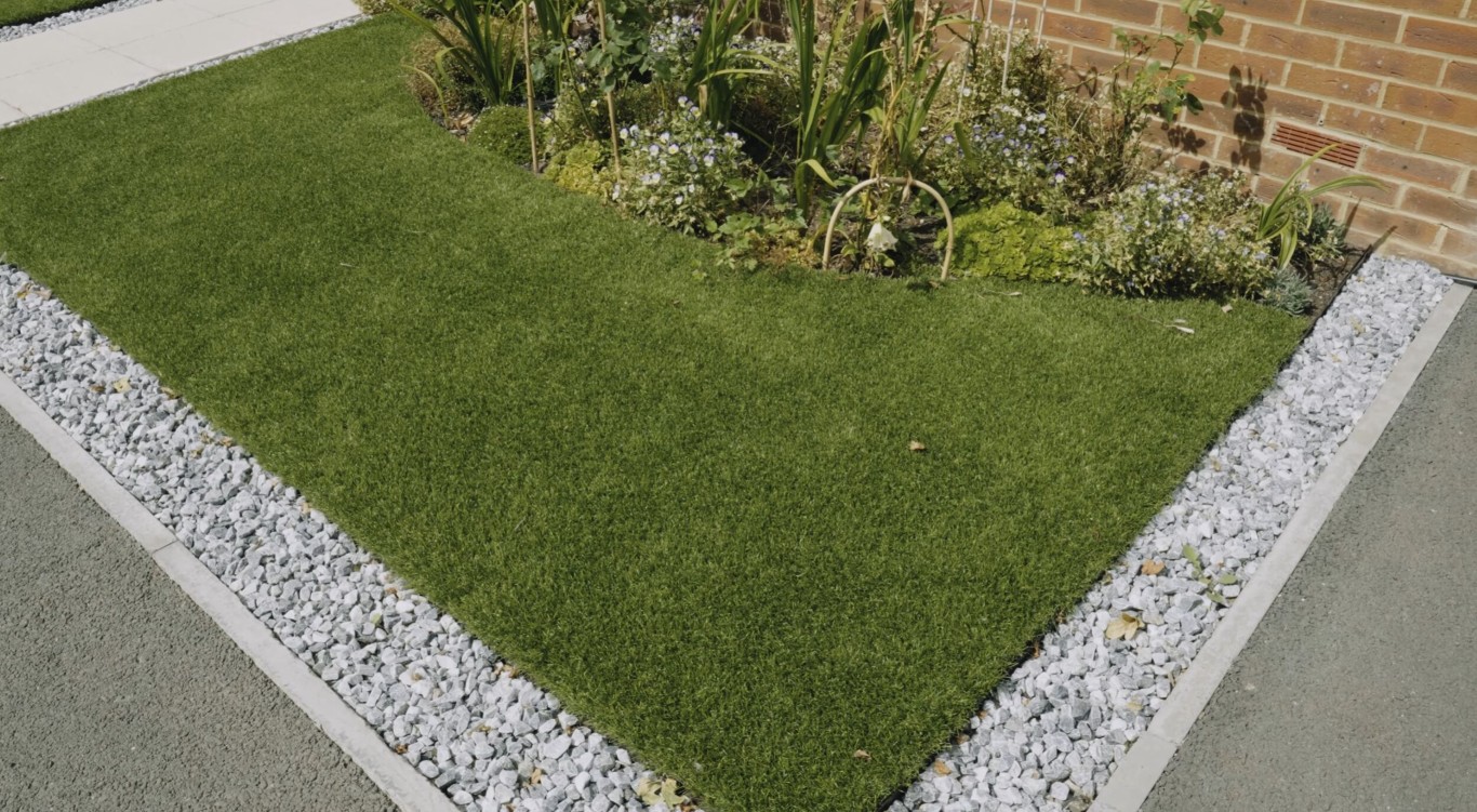 Artificial grass playground installation with safety features